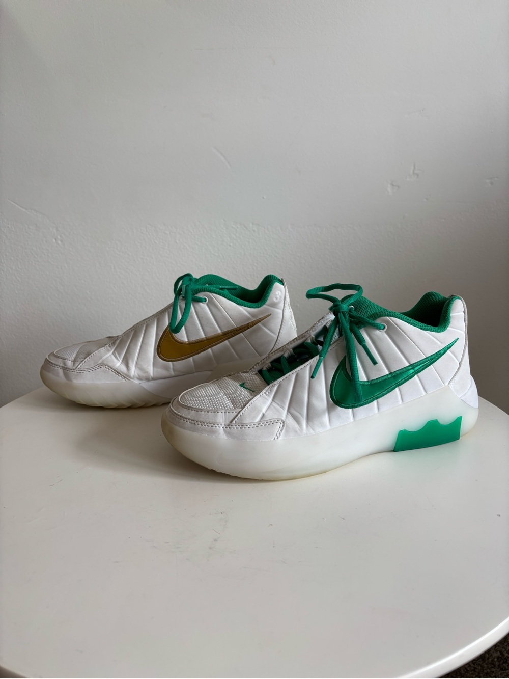 Nike Kids White Sneakers with Green Accents and Gold Swoosh